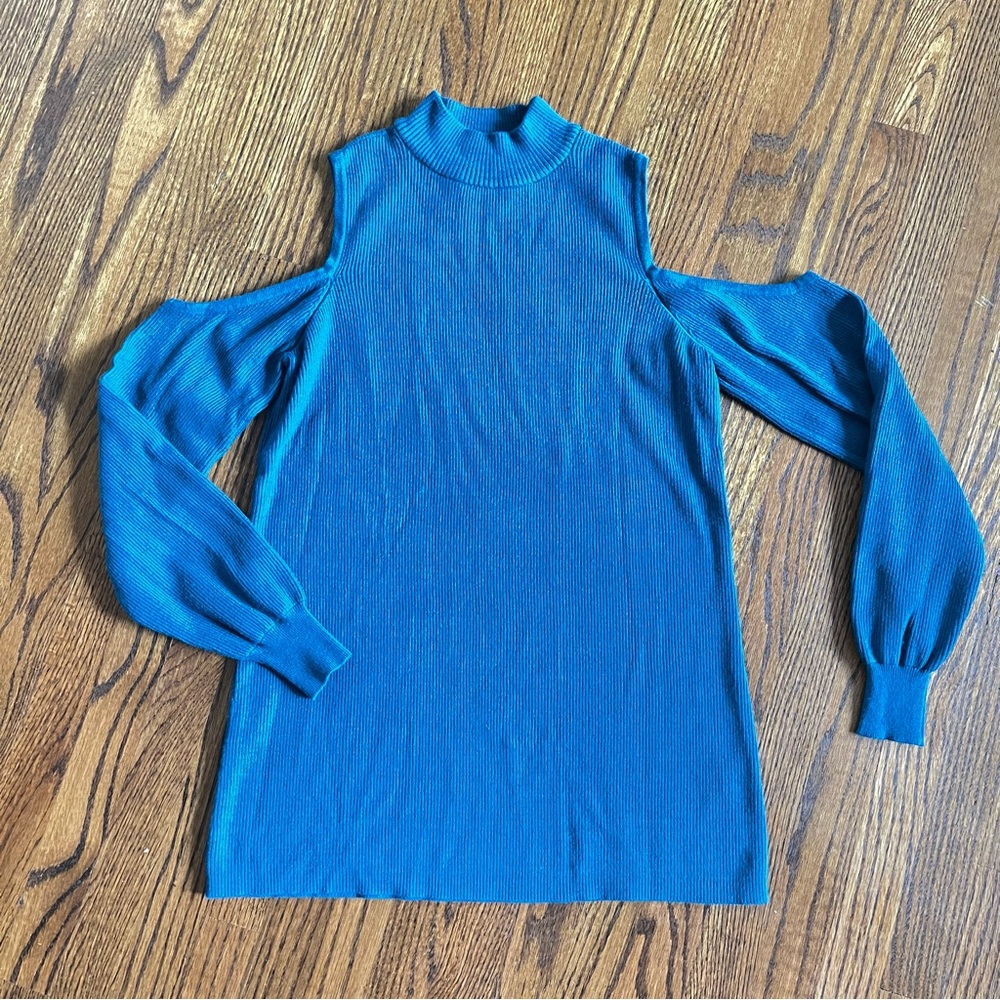 Cyrus shoulders out dark teal sweater